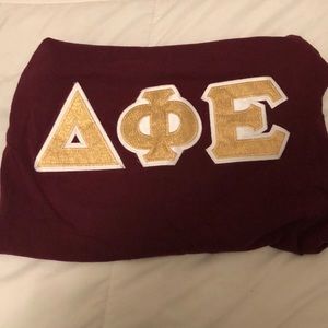 Garnet and gold DPhiE letters